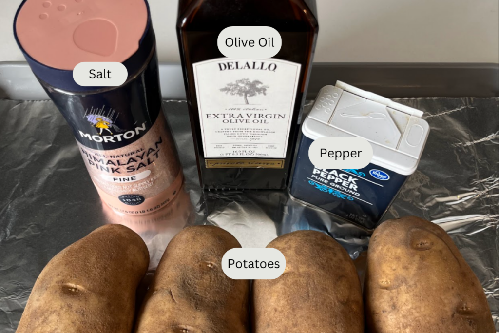 Ingredients for baked potatoes on a baking sheet.