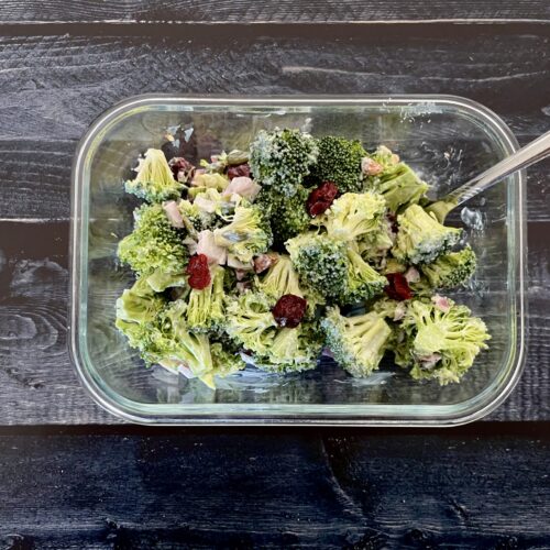 broccoli salad in a glass container.
