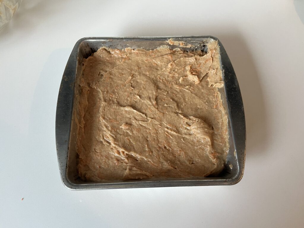 carrot cake batter in a baking dish.