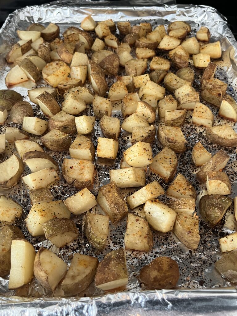 garlic roasted potatoes on a baking sheet.