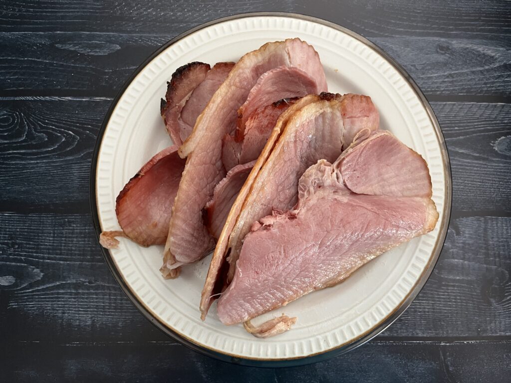stack of glazed ham on a plate.