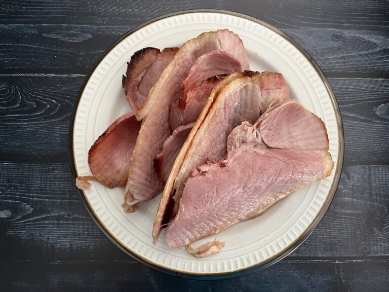 stack of glazed ham on a plate.