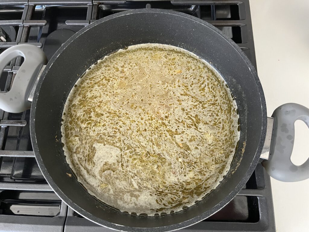 A pot of broth boiling.