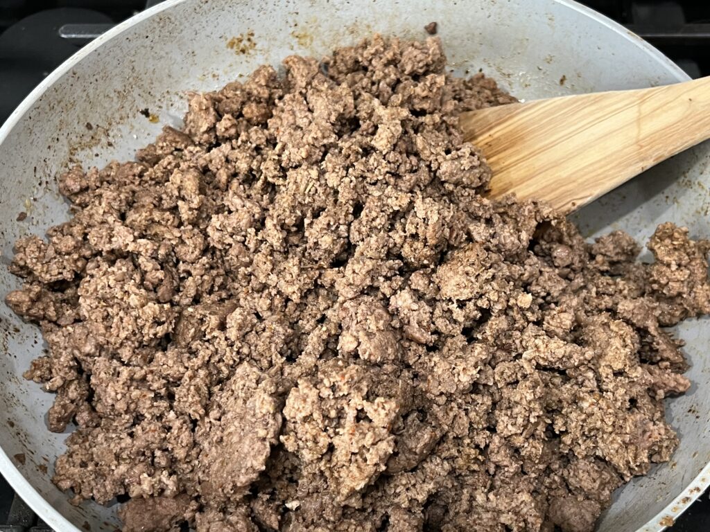A pan with cooked taco meat.