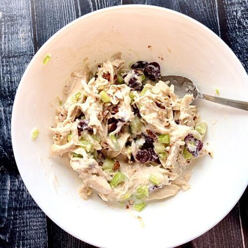 bowl of chicken salad with dried cranberries.