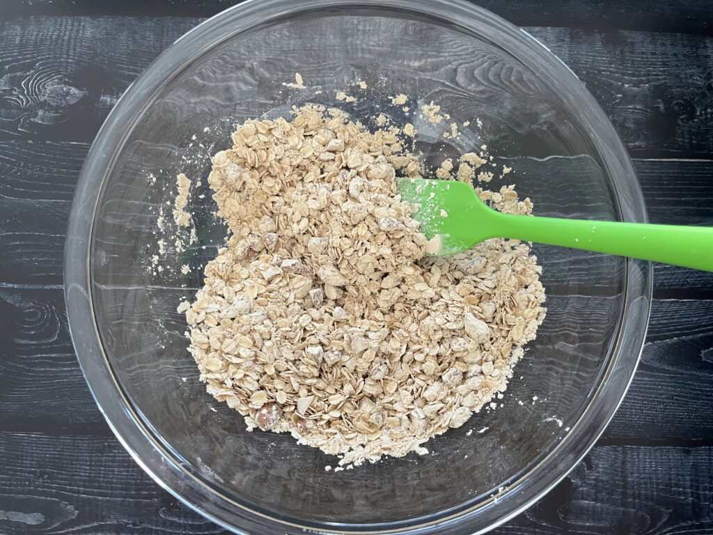 raw oats and spices mixed together in a glass bowl.