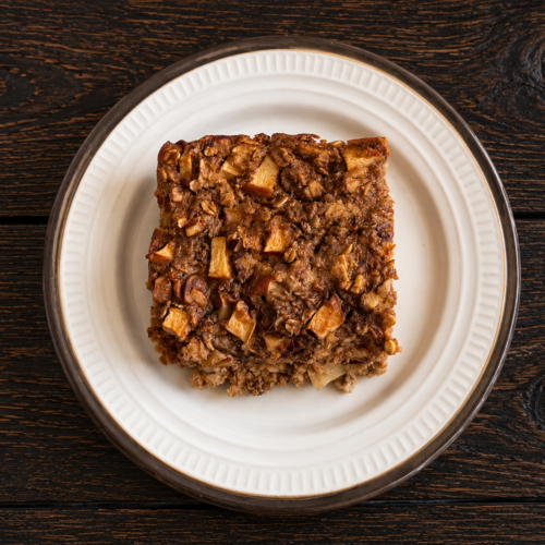 A square of cinnamon apple baked oatmeal on a plate.