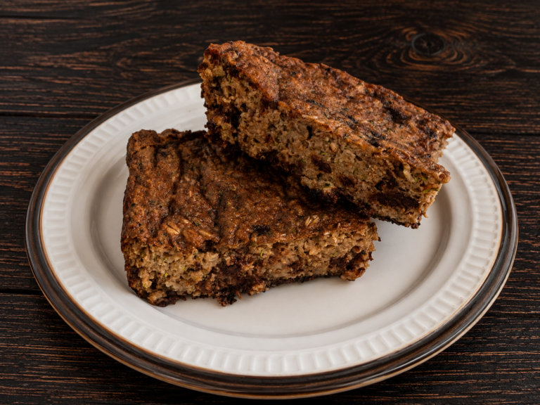 Two slices of double-chocolate zucchini baked oats on a plate.